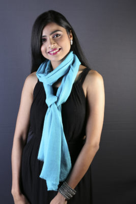 Plain pashmina shawl knotted around neck