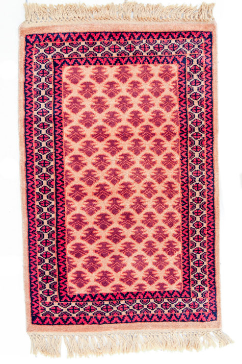 Golden bedside rug with geometric design