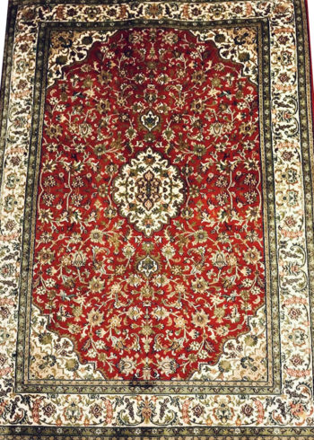 red hand knotted coffee table rug
