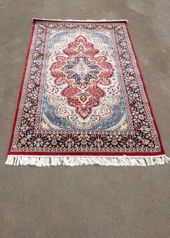 red Kashmiri made carpet