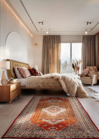 bed room with modern furniture and oriental rug