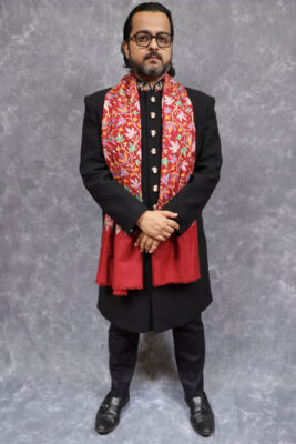 Red embroidered Kashmiri Pashmina shawl men formal neck wrap Red embroidered Kashmiri Pashmina shawl for men styled in a formal neck wrap