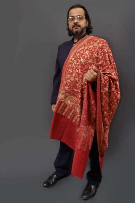 Red embroidered Pashmina shawl men formal shoulder drape Red embroidered Kashmiri Pashmina shawl for men styled in a formal shoulder drape