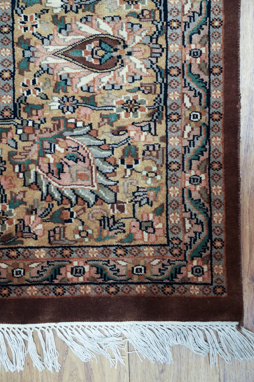 brown-hand-knotted-rug-corner-with-cotton-fringe