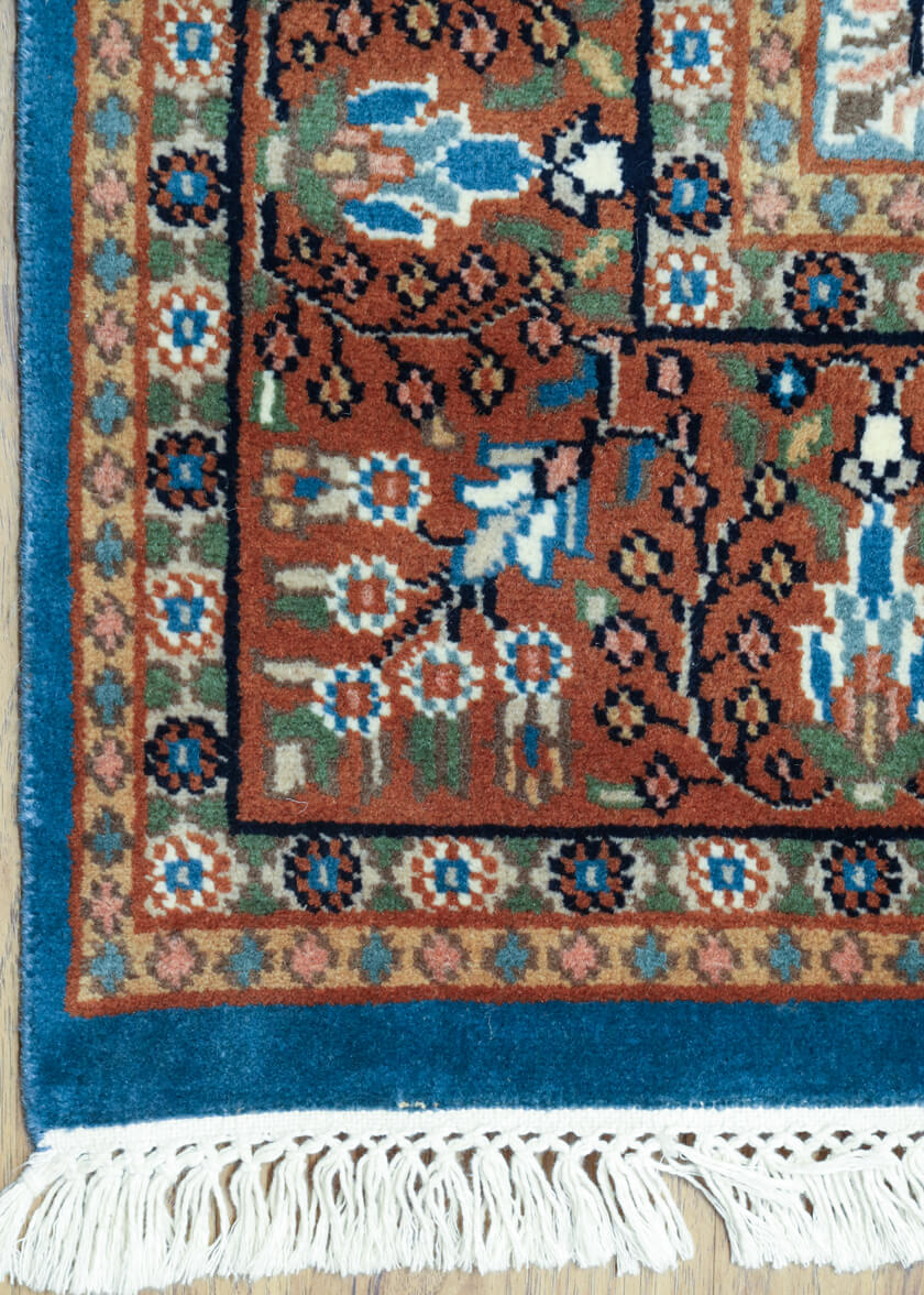 floral-border-pattern-blue-rust-persian-rug