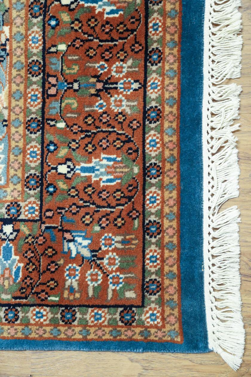 hand-knotted-blue-oriental-rug-9x6-corner-detail