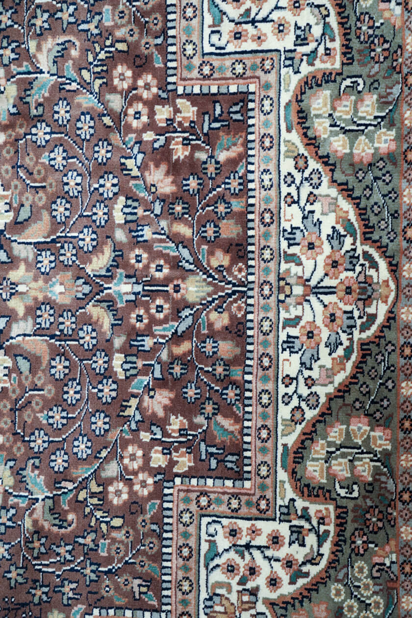 intricate-floral-motifs-brown-background-rug-detail