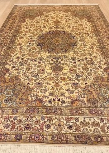 Champagne Mashhad handmade silk carpet with beige background and oriental floral design from Kashmir.