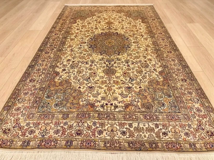 Champagne Mashhad handmade silk carpet with beige background and oriental floral design from Kashmir.