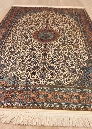 Gardenia Seirafian Kashmiri hand-knotted rug in cream color with oriental floral Persian design.