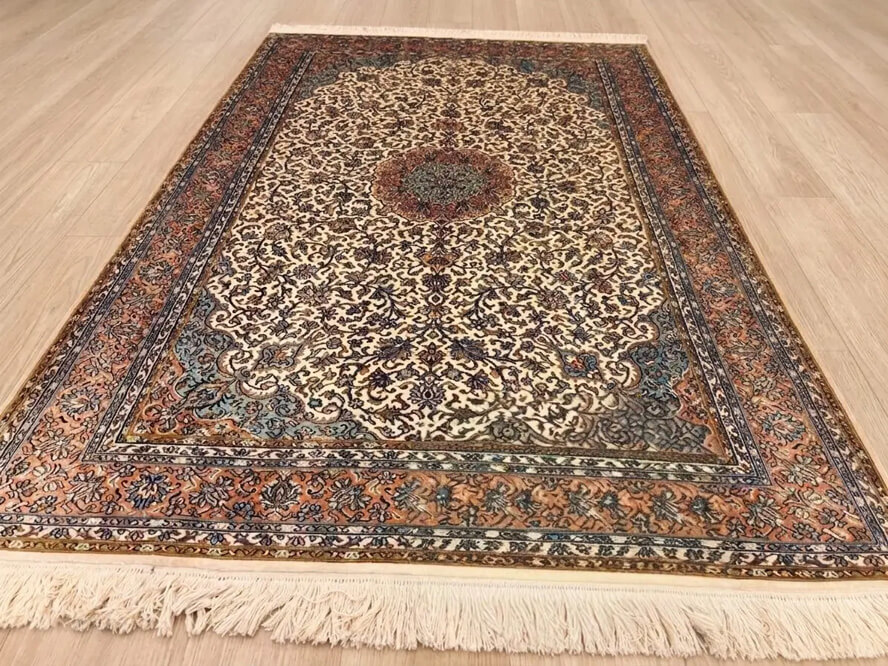 Gardenia Seirafian Kashmiri hand-knotted rug in cream color with oriental floral Persian design.