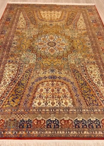 Mahogany Bakhshaish Kashmiri handmade silk carpet in rust tones handmade in India.