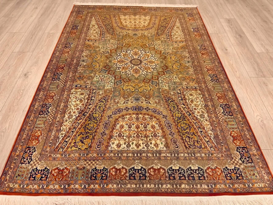 Mahogany Bakhshaish Kashmiri handmade silk carpet in rust tones handmade in India.