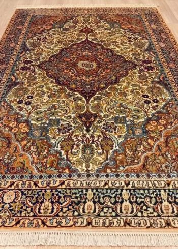 Papyrus Tabriz handmade silk rug from India with beige background and high-knot density