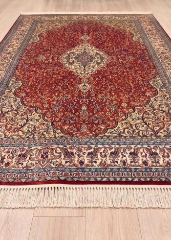 Terracotta Isfahan Kashmiri hand-knotted silk rug handmade in India with terracotta background.
