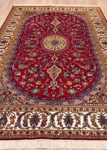 Tigerlily Oval Nain hand-knotted silk rug handmade in Kashmir, India with red background