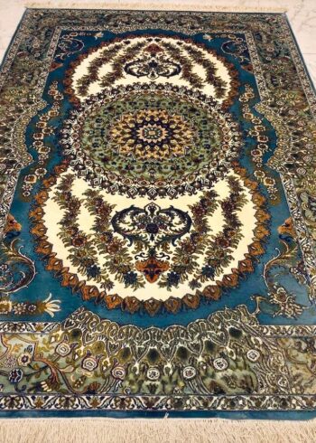 Hand-knotted Kashmiri pure silk rug in Indigo Pearl Sunburst pattern with elegant Blue highlights. 6x4 feet, 972,000 knots.