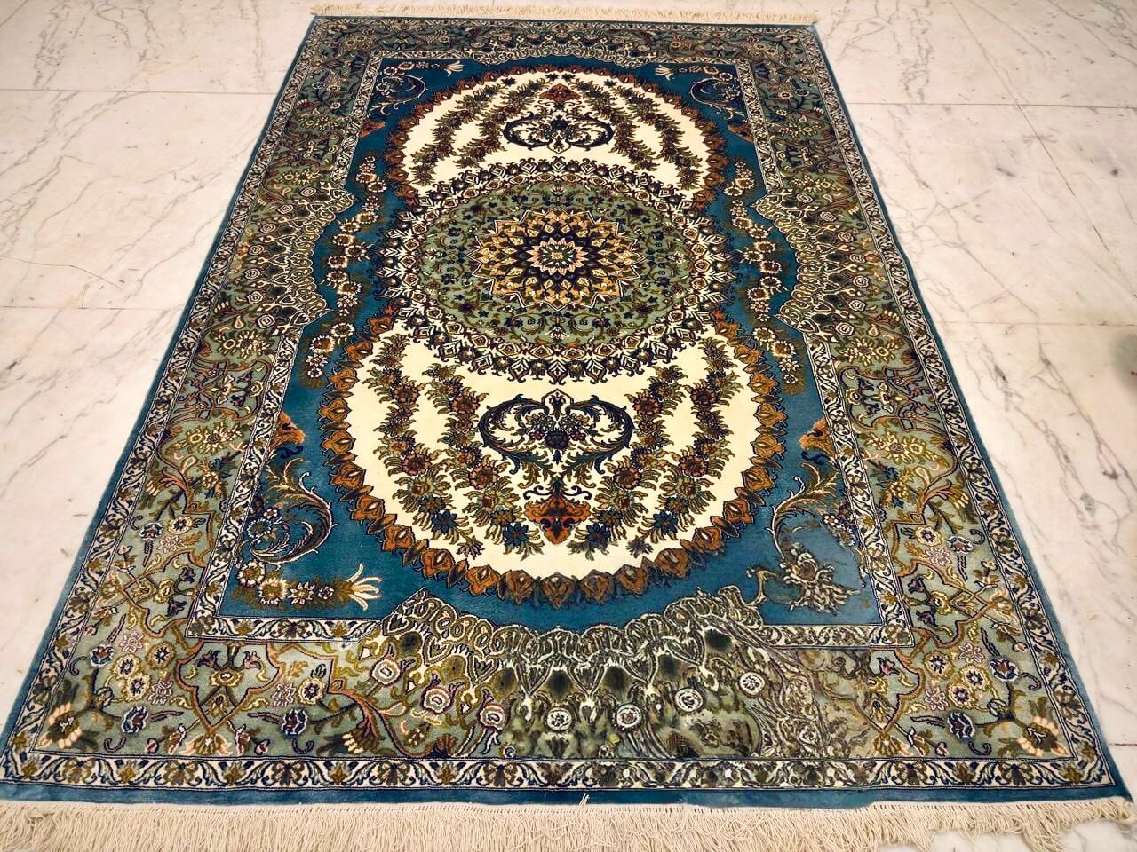 Hand-knotted Kashmiri pure silk rug in Indigo Pearl Sunburst pattern with elegant Blue highlights. 6x4 feet, 972,000 knots.
