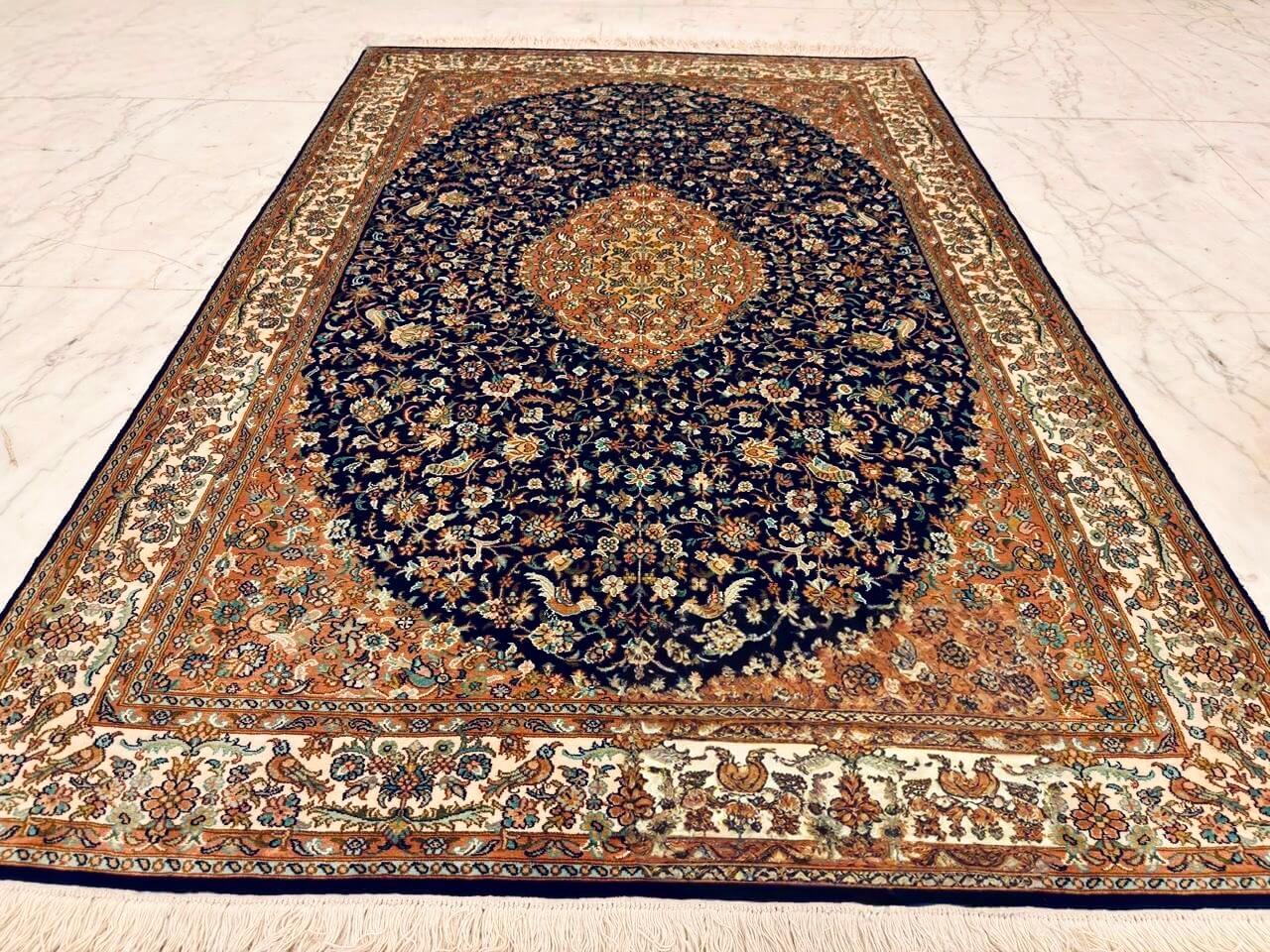 Hand-knotted Kashmiri pure silk rug in Sapphire Oval Seirafian pattern with elegant Orange highlights. 6x4 feet, 972,000 knots.