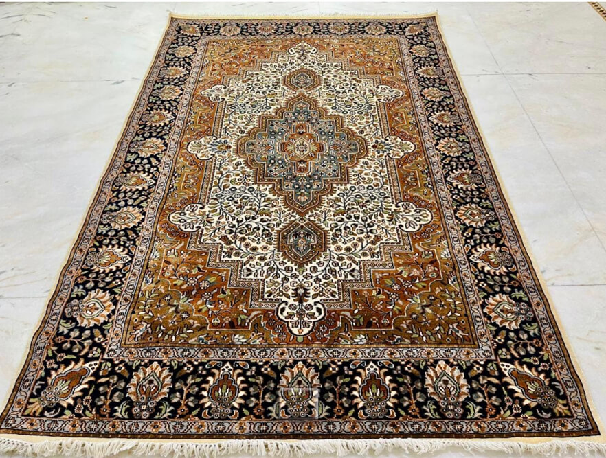 Antique Amber Isfahan wool-silk rug with a beige background, measuring 6 x 4 feet.