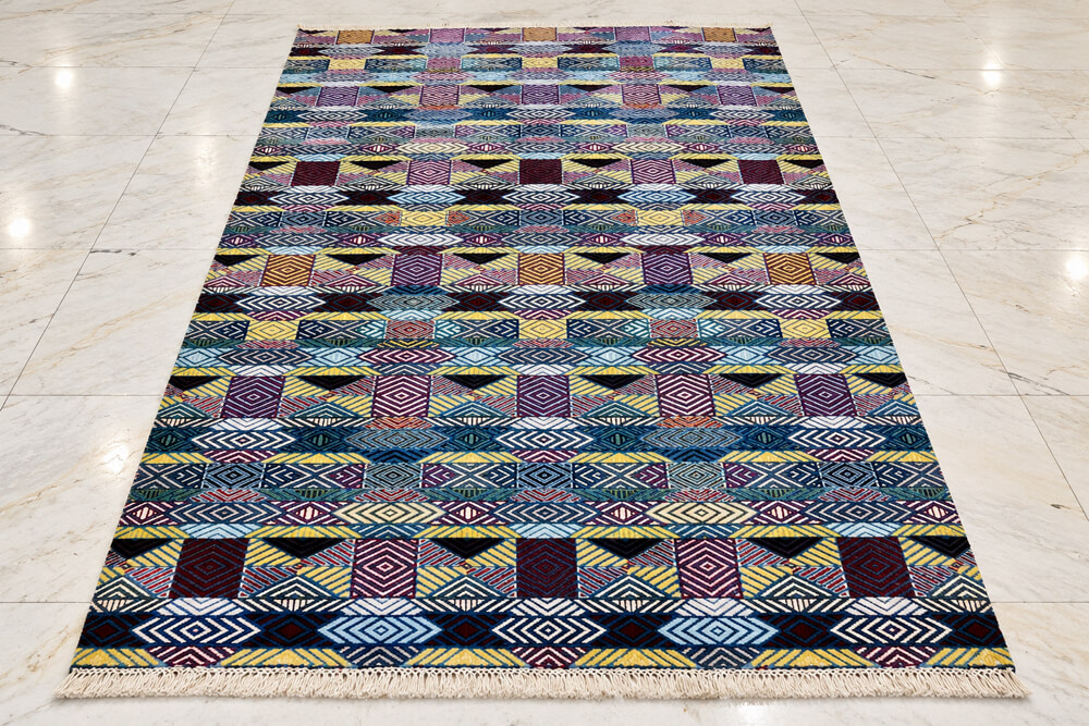 Chromatic Rhythm Kaleido wool-silk rug with a navy blue background, measuring 6 x 4 feet.