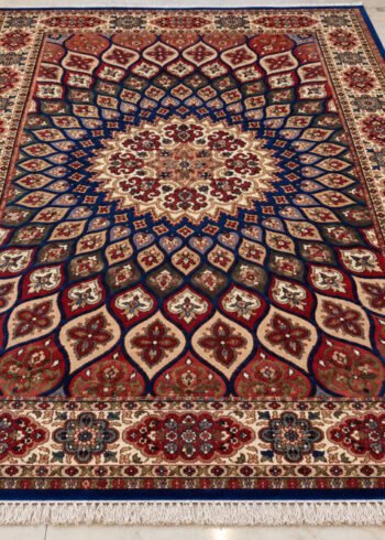 Lapis Crimson Shahzaneen wool-silk rug with a blue background, measuring 6 x 4 feet.