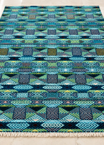 Opal-Kaleido wool-silk rug with a turquoise background, measuring 6 x 4 feet.
